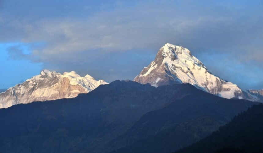 Majestic Annapurna Range glowing under the Himalayan sky – a breathtaking sight from the trekking trails of Nepal.