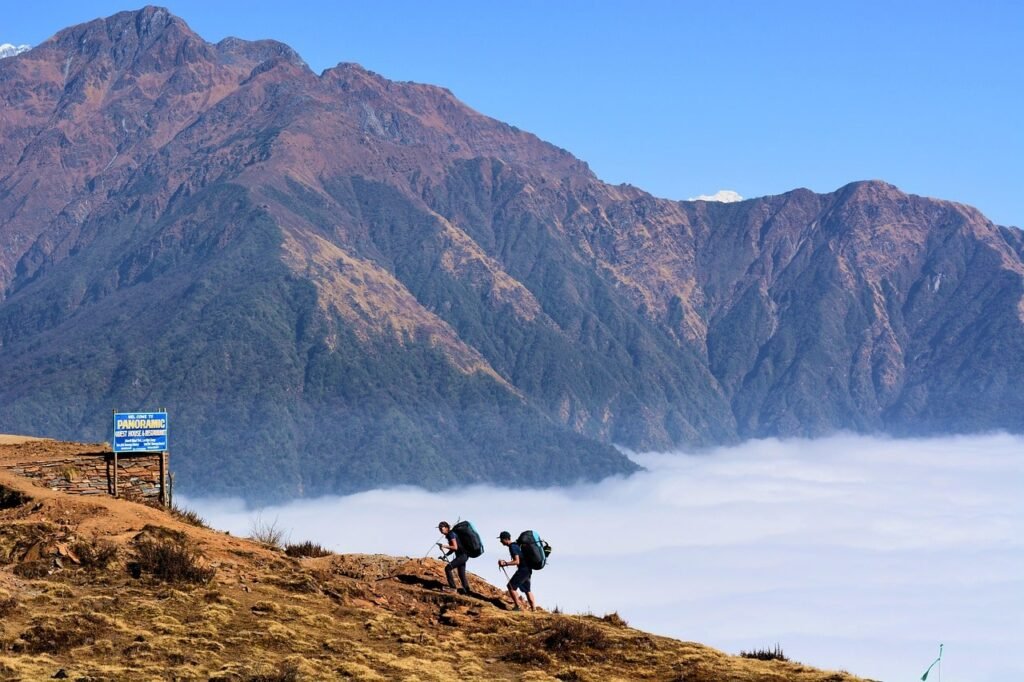 A trekker ascends a remote trail in the Manaslu Circuit, surrounded by dramatic Himalayan landscapes and untouched wilderness.