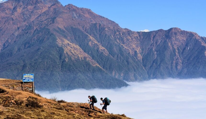 A trekker ascends a remote trail in the Manaslu Circuit, surrounded by dramatic Himalayan landscapes and untouched wilderness.