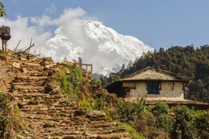 Charming Gurung village nestled amidst the Annapurna foothills, showcasing traditional stone houses and vibrant local culture on the trek to Annapurna Base Camp.