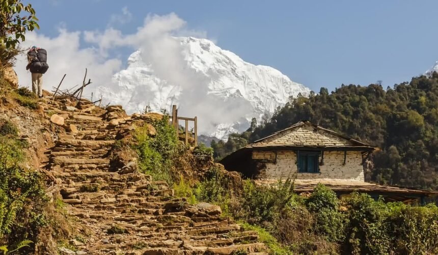 Charming Gurung village nestled amidst the Annapurna foothills, showcasing traditional stone houses and vibrant local culture on the trek to Annapurna Base Camp.